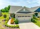 Exterior view of home, garage, and landscaping including driveway and mulch at 4511 Middlebury Ln, Fort Mill, SC 29715