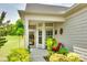 Inviting front porch and entrance, with potted plants and exterior decor at 4511 Middlebury Ln, Fort Mill, SC 29715