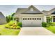 Two-car garage features an automatic door with adjacent landscaping and a concrete driveway at 4511 Middlebury Ln, Fort Mill, SC 29715