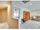Upstairs hallway with a view into a bedroom, a bookcase, and a comfortable seating area at 4511 Middlebury Ln, Fort Mill, SC 29715