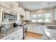 Modern kitchen with stainless appliances, granite countertops, and plenty of natural light at 4511 Middlebury Ln, Fort Mill, SC 29715