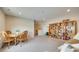 Cozy living area with a dining table set, bookcases, and comfortable seating at 4511 Middlebury Ln, Fort Mill, SC 29715