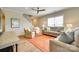 Comfortable living room featuring neutral walls, bright windows, and stylish furnishings with an orange rug at 4511 Middlebury Ln, Fort Mill, SC 29715