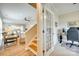 View of living spaces, foyer, and study with french doors featuring staircase and hardwood floors at 4511 Middlebury Ln, Fort Mill, SC 29715