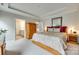 Large main bedroom featuring a closet, view to the ensuite bathroom, and cozy carpet at 4511 Middlebury Ln, Fort Mill, SC 29715