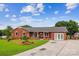 Charming brick ranch-style home with a welcoming front porch and well-manicured lawn at 4527 Marshall Ct, Monroe, NC 28110