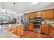 Well-equipped kitchen with stainless steel appliances and plenty of counter space connecting to the dining area at 4527 Marshall Ct, Monroe, NC 28110
