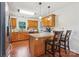 Bright and open kitchen with granite countertops, stainless steel sink, and ample counter space for cooking at 4527 Marshall Ct, Monroe, NC 28110
