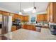 Modern kitchen with stainless appliances, granite countertops and ample cabinet space for storage and food prep at 4527 Marshall Ct, Monroe, NC 28110