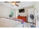 Spacious main bedroom featuring hardwood floors, TV, and a window providing natural light at 4527 Marshall Ct, Monroe, NC 28110