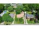 Charming single-story home featuring a well-manicured lawn, mature trees, and a private driveway at 5929 Brookhaven Rd, Charlotte, NC 28210