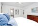 Well-lit bedroom with light walls, a dresser, and ensuite bathroom access at 5929 Brookhaven Rd, Charlotte, NC 28210