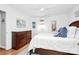 Bedroom with wood floors, a dresser, and natural light at 5929 Brookhaven Rd, Charlotte, NC 28210