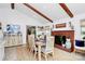 Cozy dining area with fireplace and wood beam ceilings at 5929 Brookhaven Rd, Charlotte, NC 28210