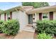 Charming front entrance with brick steps, decorative plants, and well-maintained landscaping at 5929 Brookhaven Rd, Charlotte, NC 28210