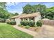 Well-maintained front yard with lush landscaping, a sidewalk and driveway, creating a welcoming curb appeal at 5929 Brookhaven Rd, Charlotte, NC 28210