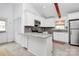 Modern kitchen with white cabinets, granite countertops, stainless steel appliances, and ample storage space at 5929 Brookhaven Rd, Charlotte, NC 28210