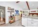 Open kitchen area with granite counters, white cabinets, and stainless appliances at 5929 Brookhaven Rd, Charlotte, NC 28210