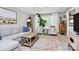 Sun-filled living room with stylish decor, a cozy seating area, and large windows offering great views at 5929 Brookhaven Rd, Charlotte, NC 28210