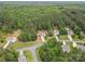 Great aerial view showing the location of a home among dense trees within a neighborhood at 6010 Hawk View Rd, Waxhaw, NC 28173