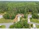Beautiful aerial view of a single-Gathering home surrounded by lush, dense trees on a large private lot at 6010 Hawk View Rd, Waxhaw, NC 28173
