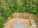 Aerial view of the home's backyard with a small garden featuring stone pathways and wooden benches at 6010 Hawk View Rd, Waxhaw, NC 28173