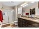 Well-lit bathroom features double sinks, a shower, and ample storage space, ideal for a modern home at 6010 Hawk View Rd, Waxhaw, NC 28173
