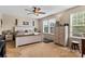 Inviting bedroom with a ceiling fan, large windows, and neutral tones, creating a relaxing atmosphere at 6010 Hawk View Rd, Waxhaw, NC 28173
