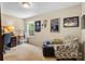 A cozy bedroom with a work desk, boxes, and ample natural light at 6010 Hawk View Rd, Waxhaw, NC 28173