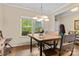Bright dining area with a large window overlooking a green yard, showcasing natural light and inviting feel at 6010 Hawk View Rd, Waxhaw, NC 28173