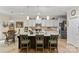 Large kitchen island with granite countertops, white cabinets, and pendant lighting offering seating and prep space at 6010 Hawk View Rd, Waxhaw, NC 28173