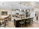 Modern kitchen island with granite countertop, pendant lights, and seating, perfect for casual dining and entertaining at 6010 Hawk View Rd, Waxhaw, NC 28173