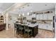 Open-concept kitchen with a spacious island, barstool seating, stainless steel appliances, and ample counter space at 6010 Hawk View Rd, Waxhaw, NC 28173