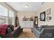 Comfortable living room featuring plush seating, soft lighting, and a calming atmosphere, perfect for relaxation at 6010 Hawk View Rd, Waxhaw, NC 28173