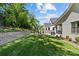 Spacious backyard showcasing a play area, patio, and well-maintained landscaping at 6013 Camile Ct, Charlotte, NC 28226