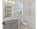 Bright bathroom features modern fixtures, a white subway tile shower, and a gray vanity at 6013 Camile Ct, Charlotte, NC 28226