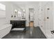 Modern bathroom with a soaking tub, walk-in shower, and sleek black and white vanity at 6013 Camile Ct, Charlotte, NC 28226