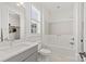 Bright bathroom features modern fixtures, a white subway tile shower, and a gray vanity at 6013 Camile Ct, Charlotte, NC 28226