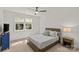 Cozy bedroom with neutral carpet, a ceiling fan, and a comfortable bed with a wooden headboard at 6013 Camile Ct, Charlotte, NC 28226