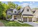 Stunning two-story home featuring a brick facade, attached garage, and professionally landscaped front yard at 6013 Camile Ct, Charlotte, NC 28226