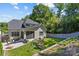 Aerial view of the backyard with a play area, patio, and well-maintained landscaping at 6013 Camile Ct, Charlotte, NC 28226