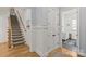 Upstairs hallway showcasing hardwood floors, staircase, and access to bedrooms and closet at 6013 Camile Ct, Charlotte, NC 28226