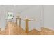 Bright upstairs hallway with hardwood flooring and an office area with built-ins at 6013 Camile Ct, Charlotte, NC 28226