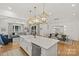 Open kitchen features island with sink and stainless dishwasher at 6013 Camile Ct, Charlotte, NC 28226