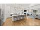 Gourmet kitchen featuring an island, pendant lighting, stainless steel appliances, and open to living area at 6013 Camile Ct, Charlotte, NC 28226
