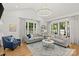 Bright living room boasts vaulted ceiling and lots of windows at 6013 Camile Ct, Charlotte, NC 28226