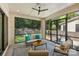 Inviting screened-in porch with comfortable seating and views of the landscaped backyard and play area at 6013 Camile Ct, Charlotte, NC 28226