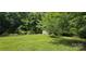 Spacious backyard featuring lush green grass and a shed at 6140 Barclay Ln, Clover, SC 29710