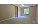 Bright bedroom with neutral walls, gray carpet, closet and natural light from a window at 6140 Barclay Ln, Clover, SC 29710