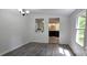 Bright dining room with a passthrough to the kitchen and a window overlooking the yard at 6140 Barclay Ln, Clover, SC 29710
